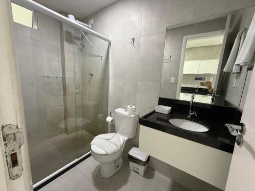 a bathroom with a toilet and a sink and a shower at Porto Vila by AFT in Porto De Galinhas