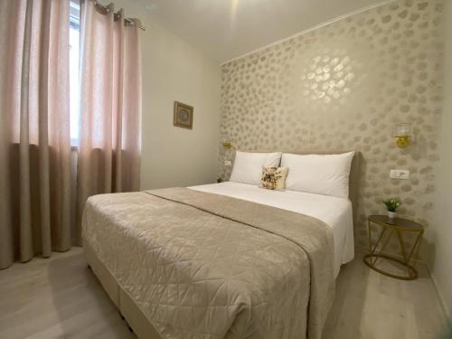 a bedroom with a large bed and a window at Lady M in Rabac - Istrien in Rabac