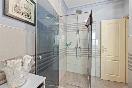 a shower with a glass door in a bathroom at Lady M in Rabac - Istrien in Rabac