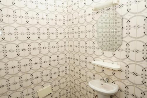 a bathroom with a sink and a toilet at Cozy loft Bonamoussadi Douala in Douala