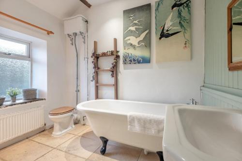 a white bathroom with a tub and a toilet at 3 Bed in Nenthead oc-c34668 in Nenthead