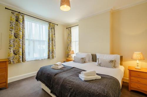 a bedroom with a bed with towels on it at 3 Bed in Gosforth oc-s34885 in Gosforth