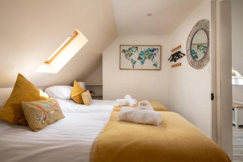 a bedroom with two beds with towels on them at 2 Bed in Alkham oc-v34789 in Swingfield