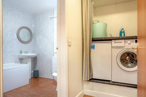 a bathroom with a washing machine and a sink at 2 Bed in Escomb oc-o34978 in Acomb