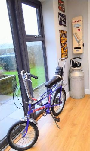 a bike parked in a room with a window at Englefield Guesthouse in Goathland