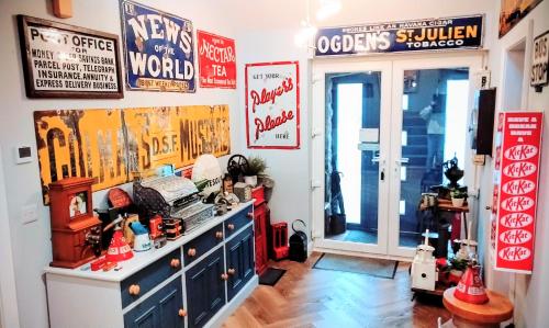 a room with signs on the wall and a dresser at Englefield Guesthouse in Goathland