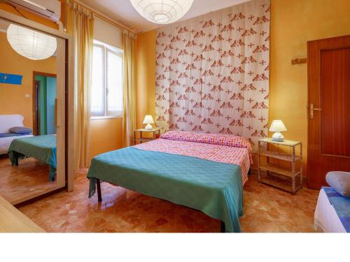 Postel nebo postele na pokoji v ubytování I Tetti Di Sassari B&B