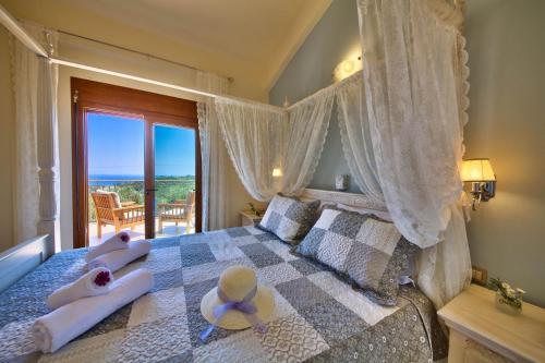 a bedroom with a bed with two towels on it at Villa Androniki in Longós