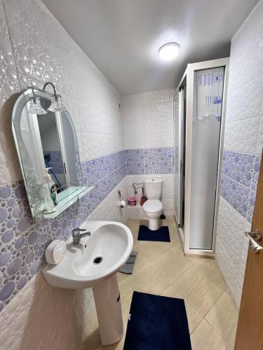 a bathroom with a sink and a toilet at Apartmen rentals with M Z in Marrakesh