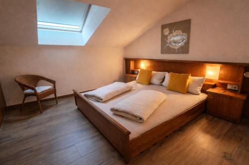 a bedroom with a large bed with a skylight at Apartment Fischer in Tarrenz