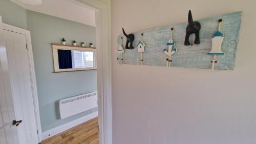 a room with a wall with a knife rack at 7 The Burrows in Braunton