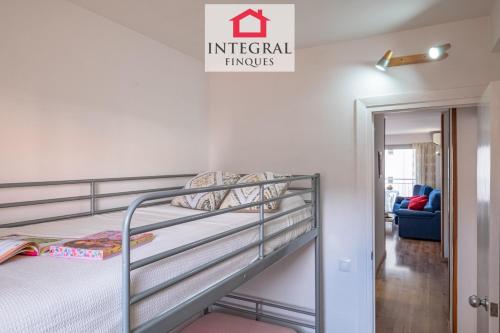 a bedroom with a bunk bed and a staircase at Why Not Apartment Palamós in Palamós