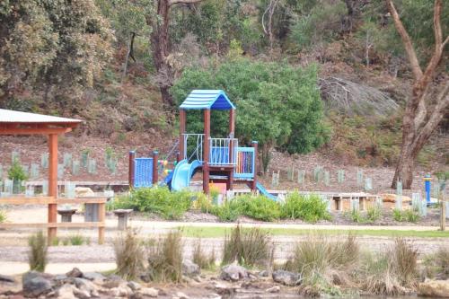a playground with a slide in a park at Holiday Home in the Heart of Anglesea in Anglesea
