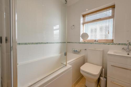 a bathroom with a toilet and a tub and a sink at 2 Bed in Bishopston oc-h28996 in Bishopston