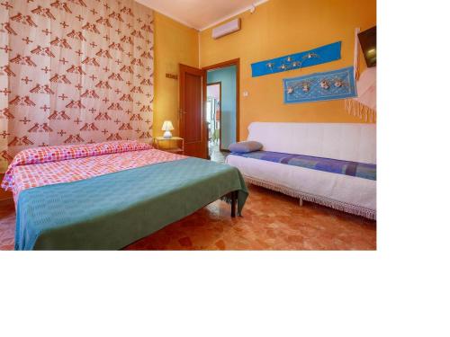 Un ou plusieurs lits dans un hébergement de l'établissement I Tetti Di Sassari B&B