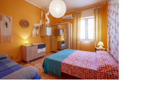 Ένα ή περισσότερα κρεβάτια σε δωμάτιο στο I Tetti Di Sassari B&B