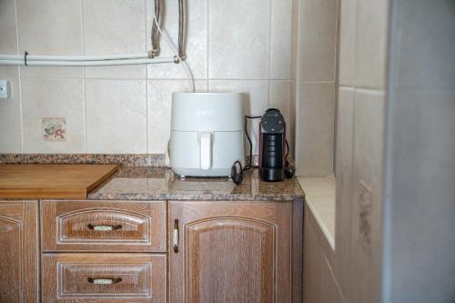 a coffeemaker sitting on top of a kitchen counter at Bungalow and private XXL Terrace in Alicante