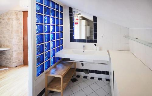 a bathroom with a sink and a mirror at VISTA ART sea view in Funtana