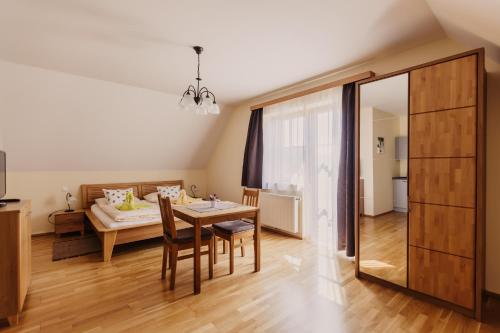 a living room with a table and a couch at Gästezimmer & Weingut Gamser in Leutschach