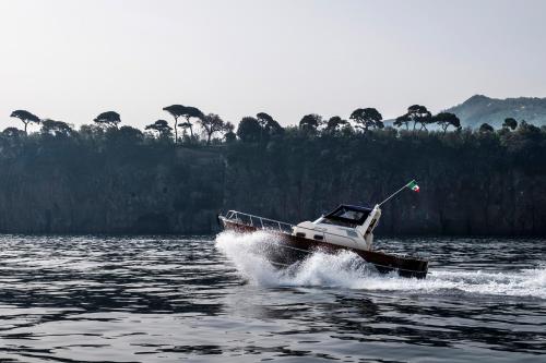 a small boat on a body of water at B&B L'Approdo in Piano di Sorrento