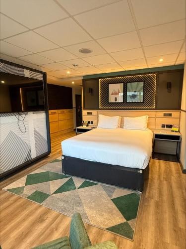 a bedroom with a large bed in a room at DoubleTree by Hilton Coventry Building Society Arena in Coventry