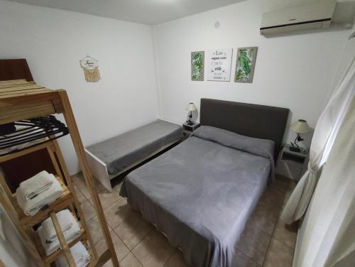 a small room with two beds in it at Departamento Marusa in Gualeguaychú