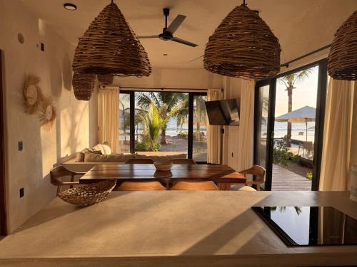 a living room with a table and a couch at Aldea Cayaco Villa A1 in La Manzanilla