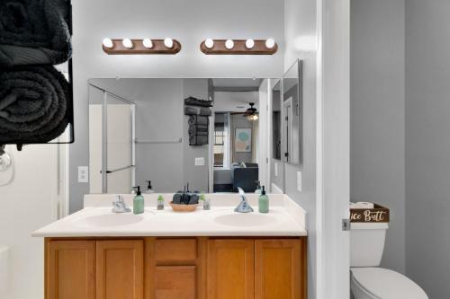 a bathroom with a sink and a mirror at Kindroot 5 in Tucson