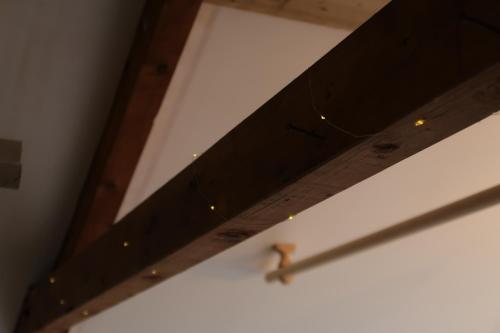 a small bird sitting on top of a ceiling at The Biscuit Box Ideal For Couples Or Families in Low Hesket