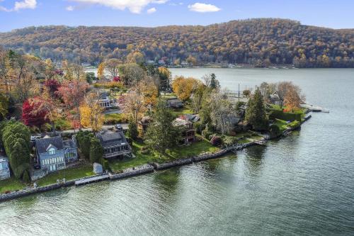 an aerial view of a house on the shore of a lake at Candlewood Isle in New Fairfield
