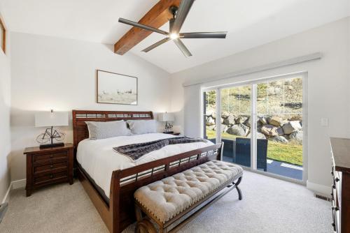 a bedroom with a bed and a ceiling fan at Snowline at Black Rock Ridge in Kamas
