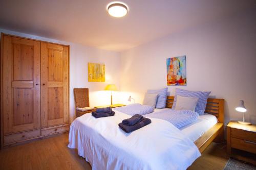 a bedroom with a bed with two towels on it at Atelier am Hochrhein in Büsingen
