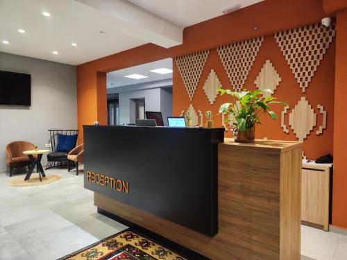 an office lobby with a reception desk and a reception counter at MIK Hotel Korça in Korçë