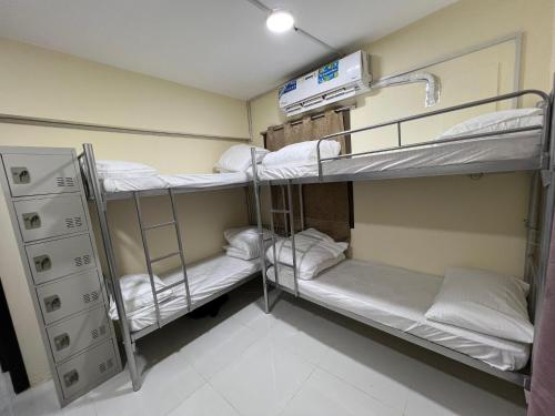 a room with two bunk beds in a hospital at Universe Holiday Homes in Dubai