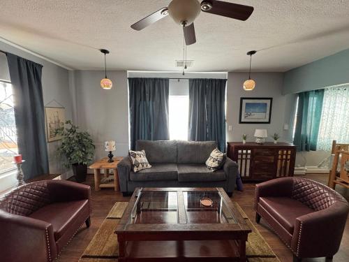 a living room with a couch and chairs and a table at Casa 131 in Tucson