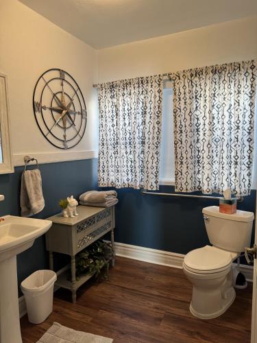 a bathroom with a toilet and a sink at Casa 131 in Tucson