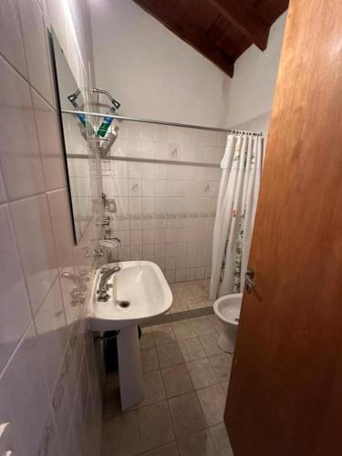 a bathroom with a sink and a toilet at OKIN 25 New in Costa del Este