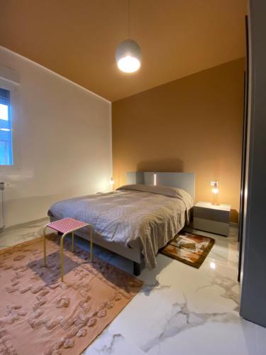 a bedroom with a large bed and a rug at Apartment Rino 1 Caorso in Caorso