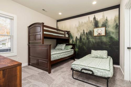a bedroom with two bunk beds and a painting on the wall at Valley View in Basye