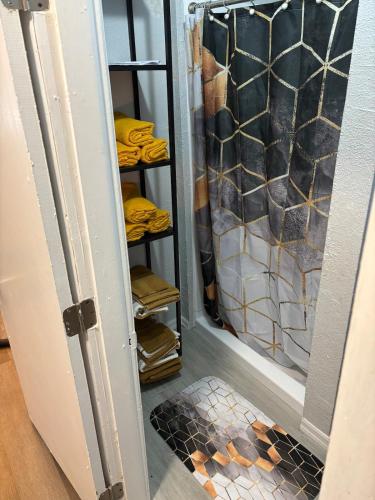a closet with a glass door and a shower at Urban Oasis in Jacksonville