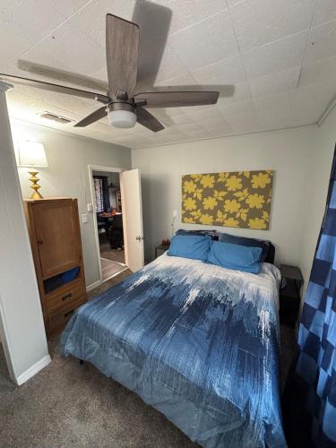 a bedroom with a bed and a ceiling fan at Urban Oasis in Jacksonville