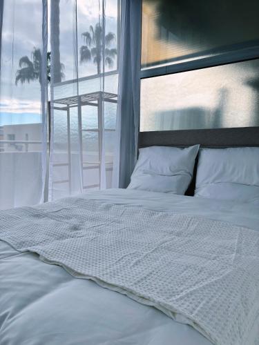 เตียงในห้องที่ Holidays 80