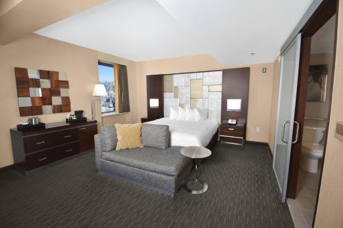 a hotel room with a bed and a chair at Hilton San Francisco Union Square in San Francisco