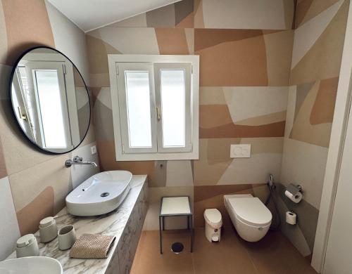 a bathroom with a sink and a mirror at Sea view villa San Agustin vista Claveles in San Agustin