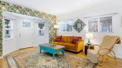 a living room with a couch and a table at Urban Jungle by AvantStay in Los Angeles