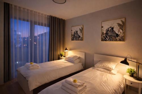 Llit o llits en una habitació de City Premium