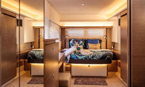 a bedroom with two beds in a room at Akula Catamaran - N4 Charters Seychelles in Victoria