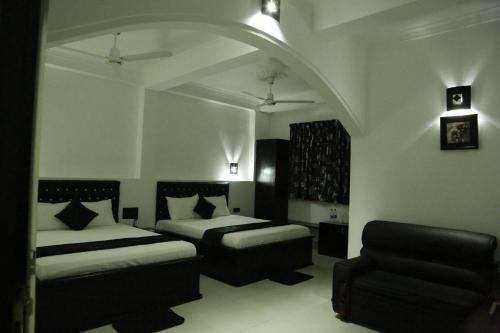 Postel nebo postele na pokoji v ubytování Villa Hotel