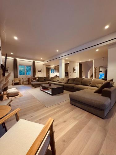 a large living room with a couch and a table at eleni's villa in Kandhíla