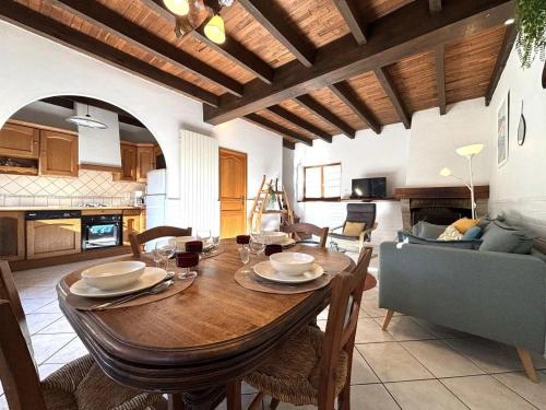 a kitchen and dining room with a table and chairs at gite du navech in Camjac